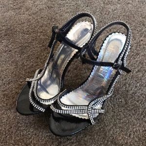 Delicacy brand black and rhinestone shoes.